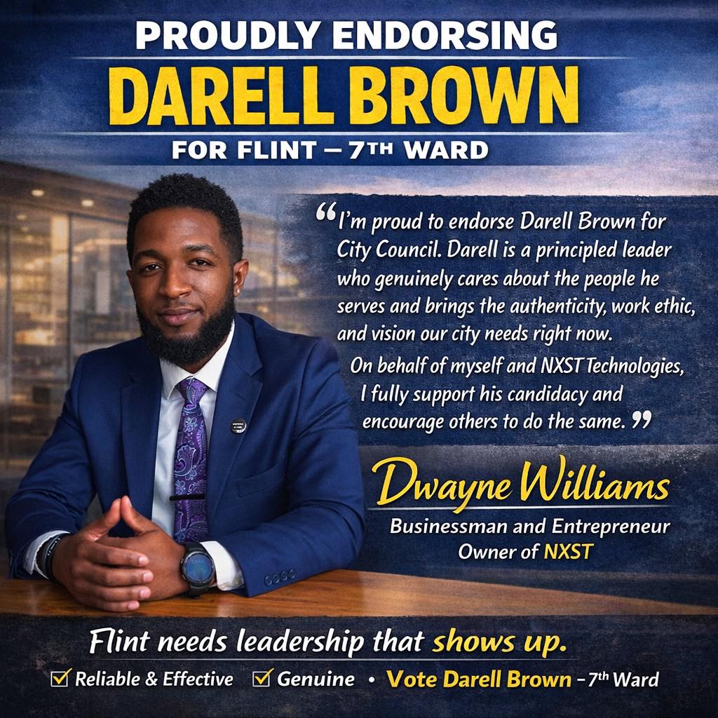 Flint community member standing with Darell Brown