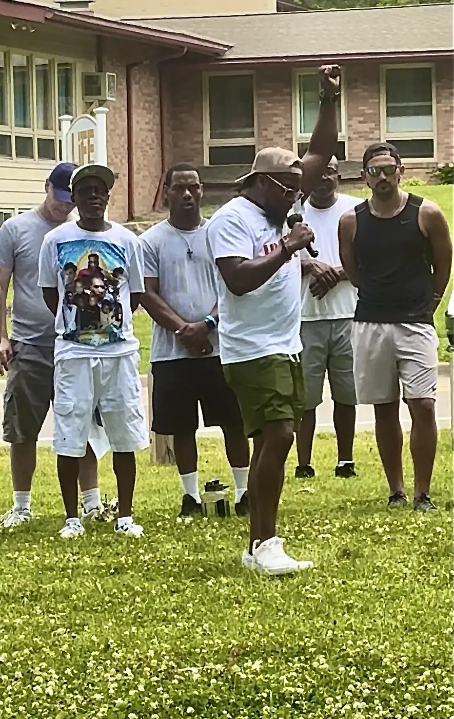 Darell Brown with neighbors at an outdoor community gathering