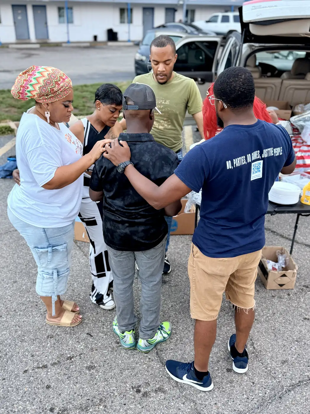 Darell Brown talking with residents at an outdoor event