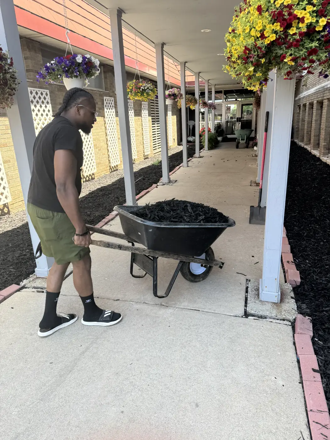 Darell Brown moving supplies during a community cleanup