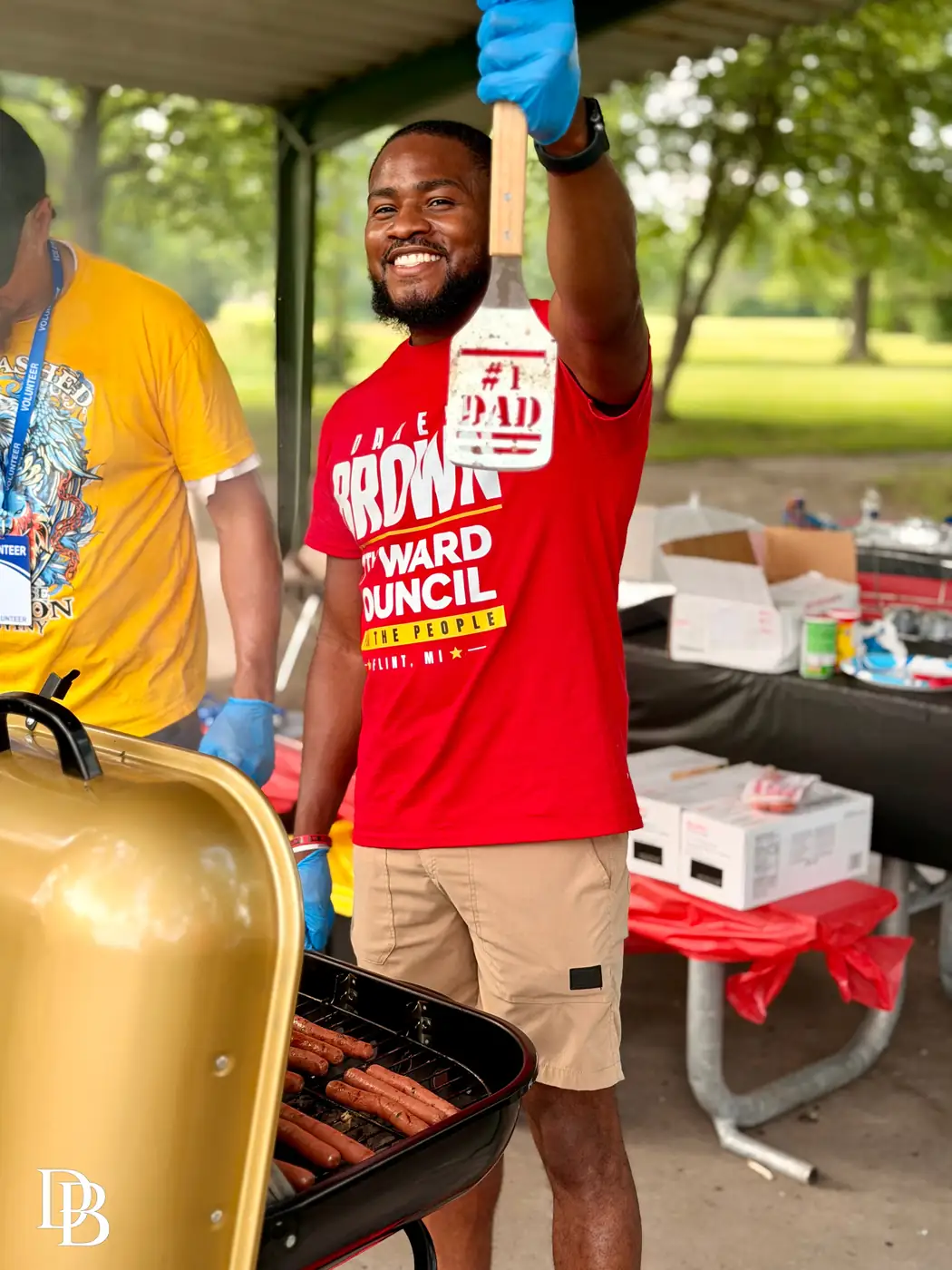 Darell Brown grilling food for neighbors at a community event