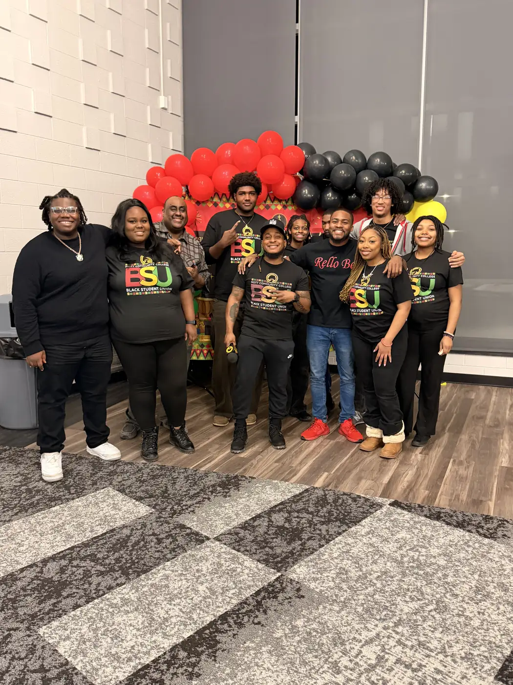 Darell Brown with volunteers at an indoor community event