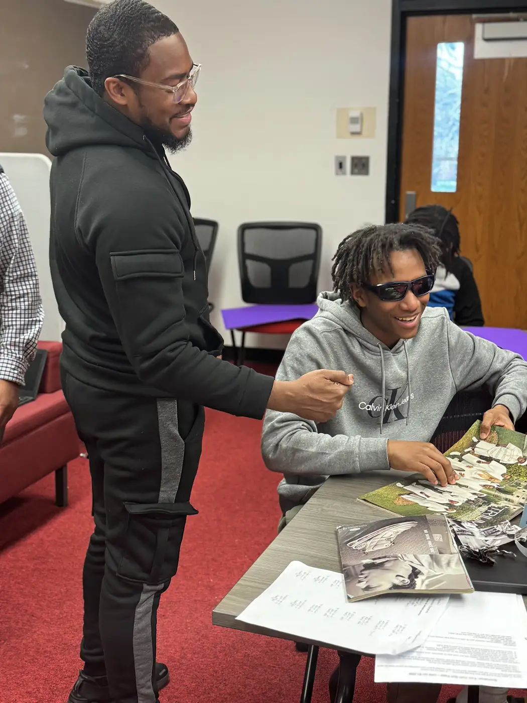 Darell Brown distributing food and supplies to a resident