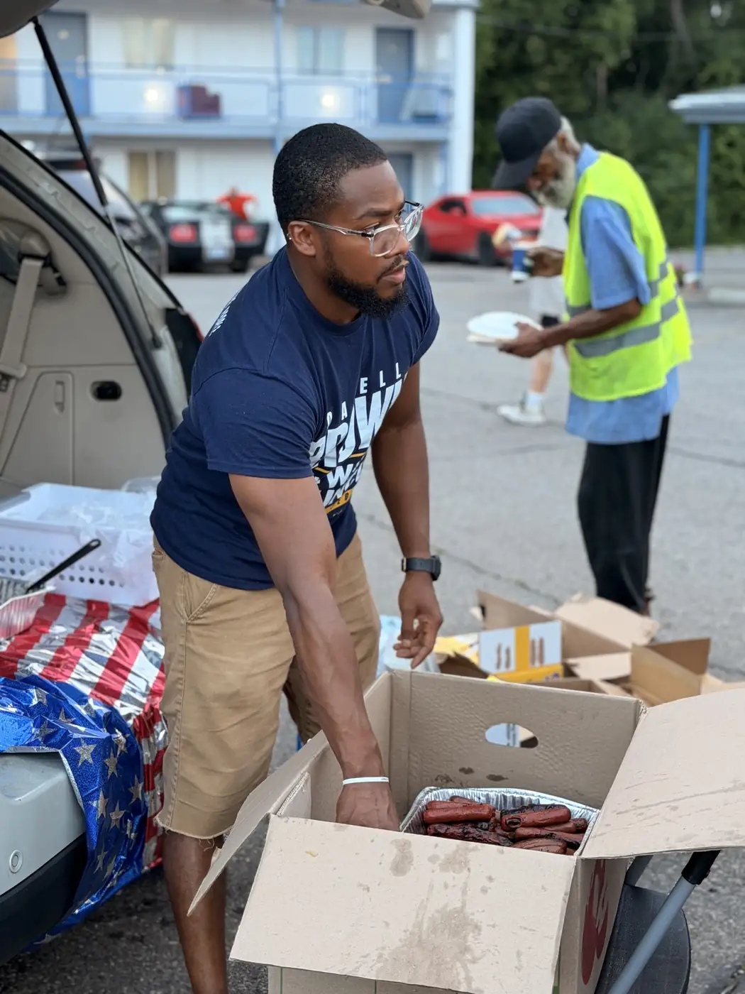 Darell Brown loading food boxes during a distribution event