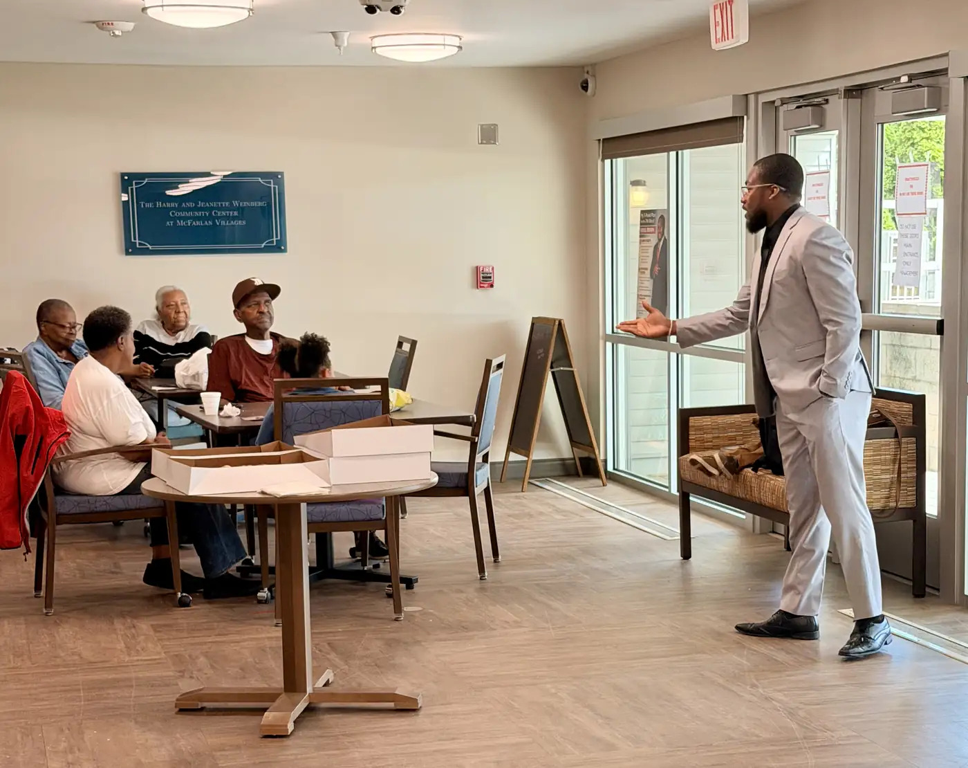 Darell Brown speaking to residents in a classroom setting