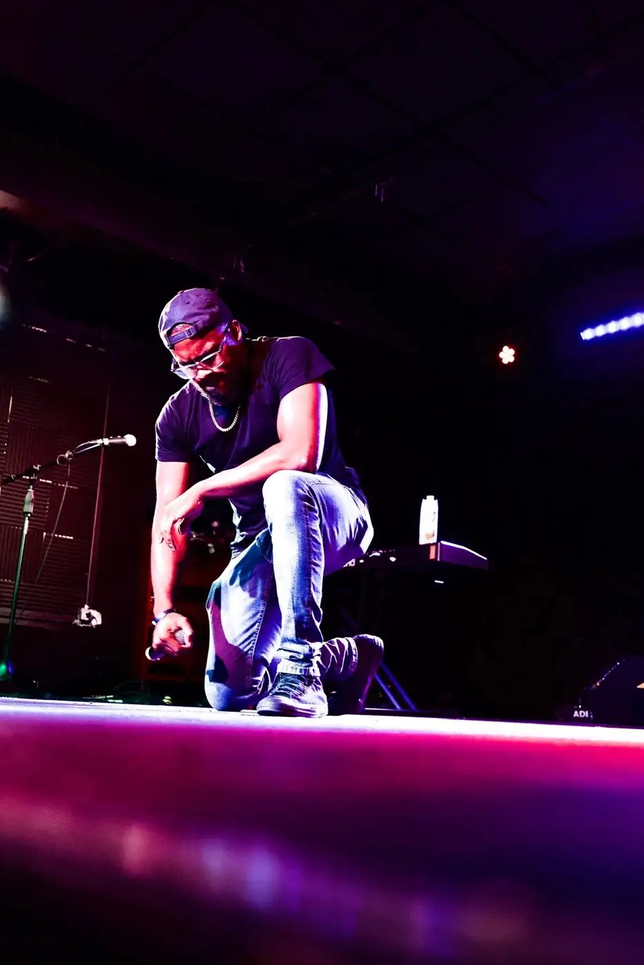 Darell Brown speaking and performing on a community stage
