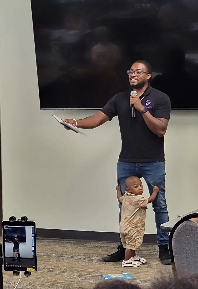 Darell Brown addressing residents at a community meeting